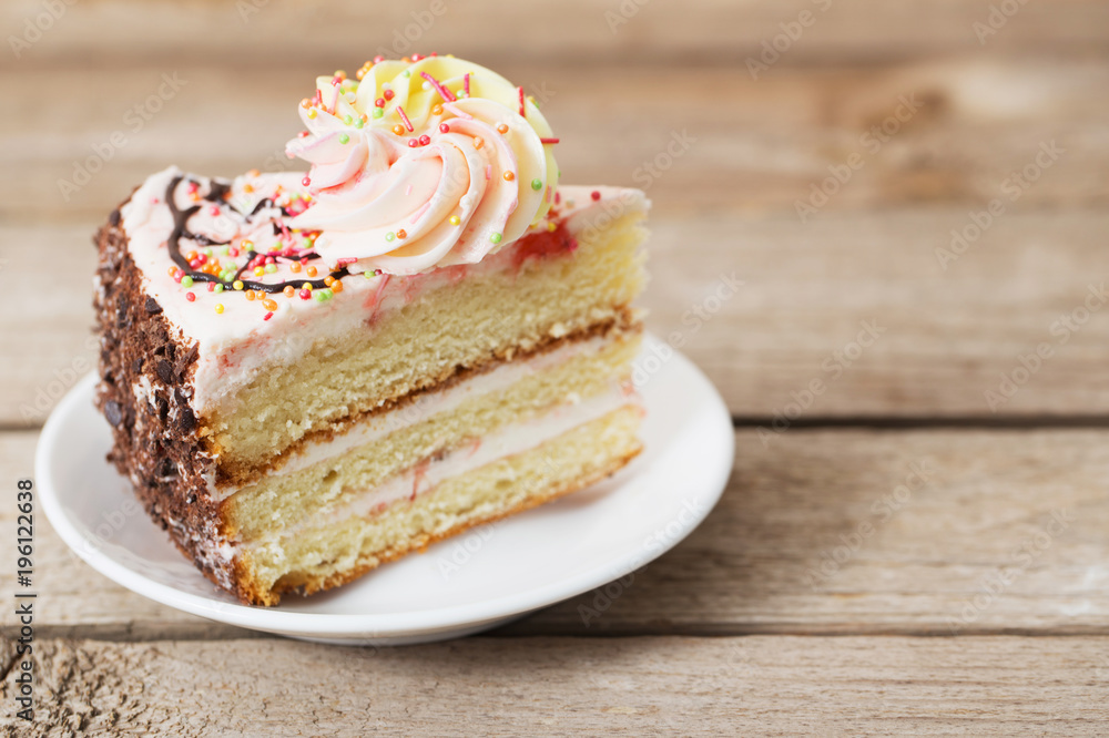 piece of cake on a wooden table piece of cake on a wooden table