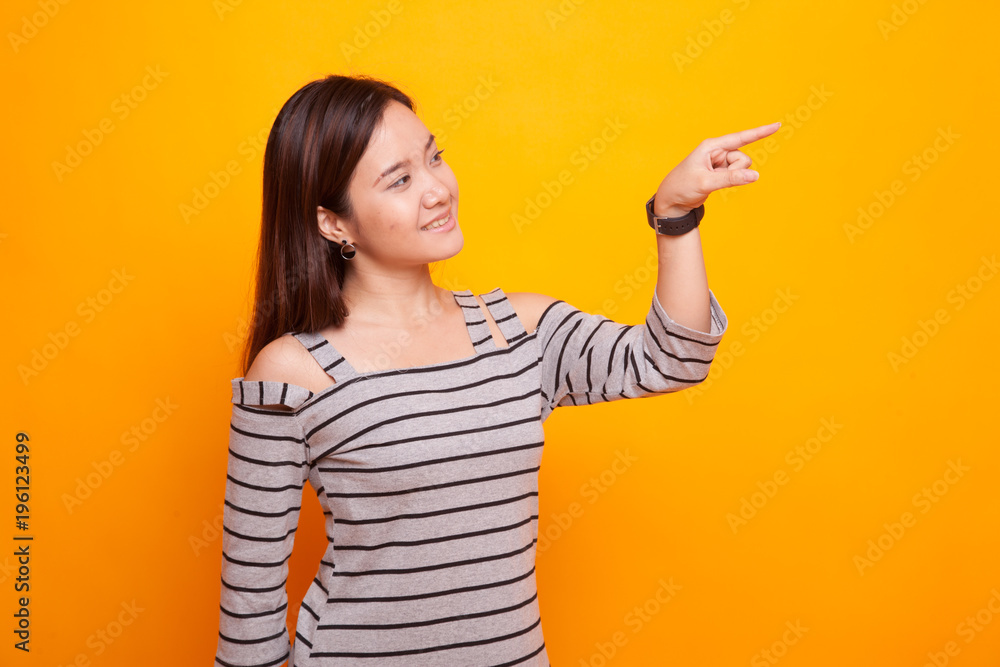 Asian woman touching the screen with finger. Asian woman touching the screen with finger.