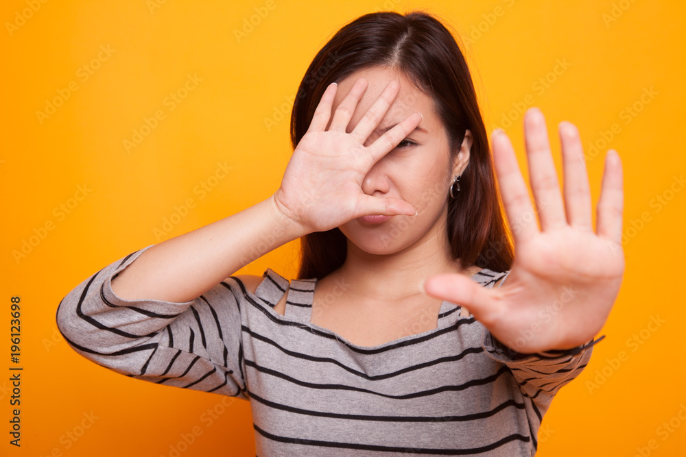 Young Asian woman hide her face. Young Asian woman hide her face.