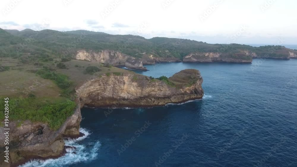 Flying Towards Sea Cliffs in Bali Indonesia Flying Towards Sea Cliffs in Bali Indonesia