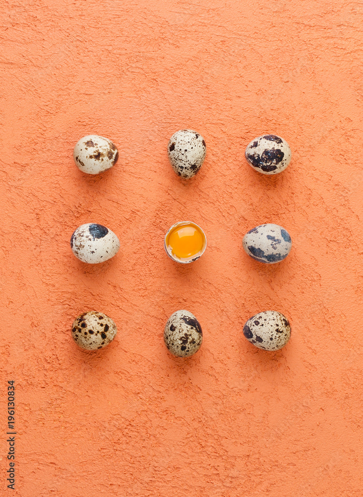 Quail eggs on a textured orange background. Food concept.. Quail eggs on a textured orange background. Food concept..