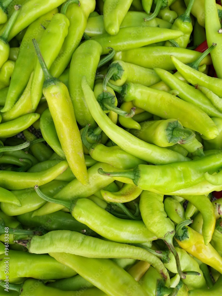 culinary background of fresh hot green chillies culinary background of fresh hot green chillies