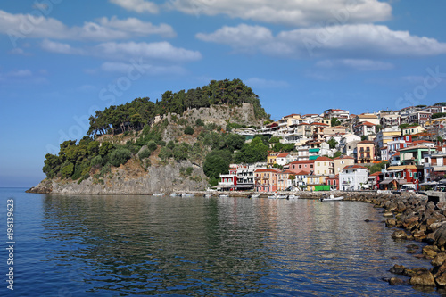 old ruined fortress on hill and colorful buildings Parga Greece summer season