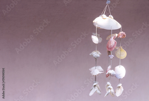 Seashells hanging on white background. Seashell mobile is handicrafts produced by handmade.