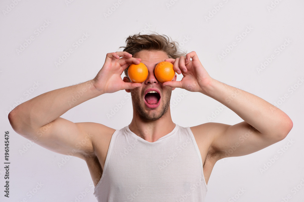 Guy with surprised face isolated on light grey background Guy with surprised face isolated on light grey background