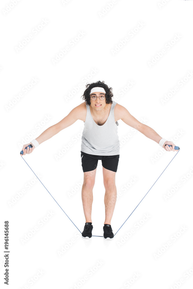 Thin sportsman in eyeglasses standing on jump rope isolated on white Thin sportsman in eyeglasses standing on jump rope isolated on white