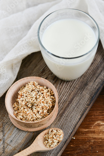 sesame milk sesame seed in a glass on wooden background, concept of healthy eating, organic food, gluten-free and aslacton vegetable milk.