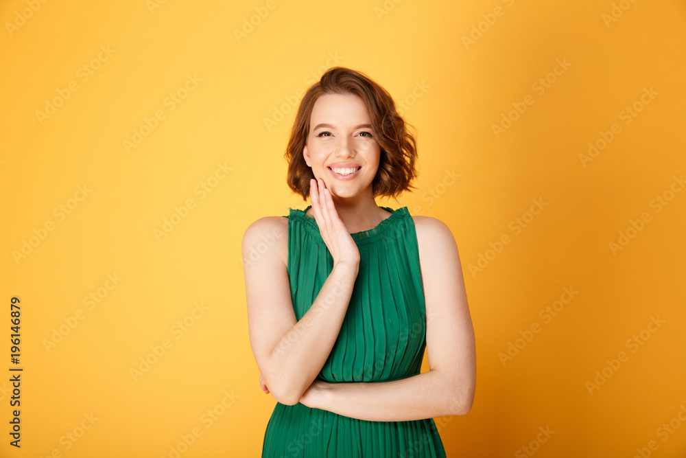 portrait of pretty smiling woman looking at camera isolated on orange portrait of pretty smiling woman looking at camera isolated on orange