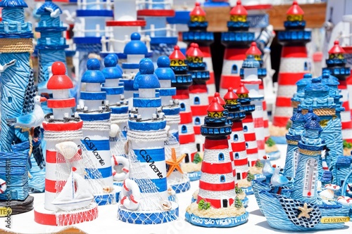 Colourful souvenir lighthouses, Cape St Vincent, Algarve, Portugal.