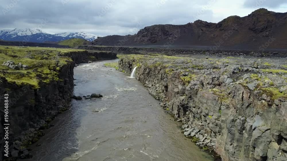 Through Iceland River Canyon Towards Distant Mountains Through Iceland River Canyon Towards Distant Mountains
