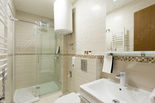 Interior of a hotel bathroom with shower cabin