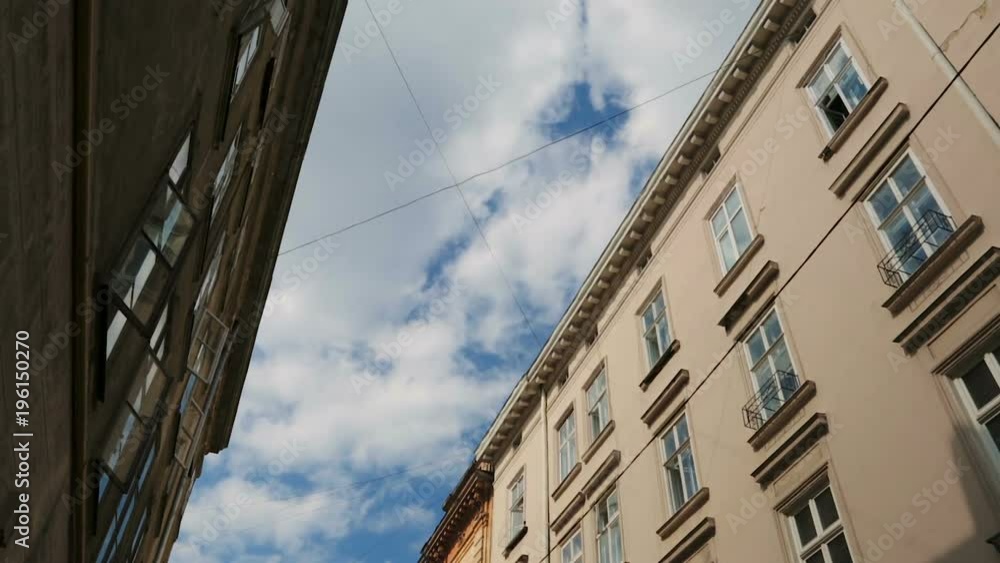 Blue sky with white running clouds between ancient architecture, time-lapse Blue sky with white running clouds between ancient architecture, time-lapse