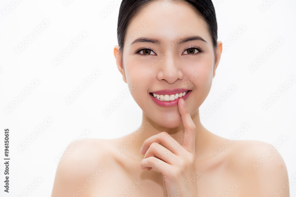Smiling young and beautiful Asian woman pointing to white teeth smile isolated over white background studio shot. Smiling young and beautiful Asian woman pointing to white teeth smile isolated over white background studio shot.