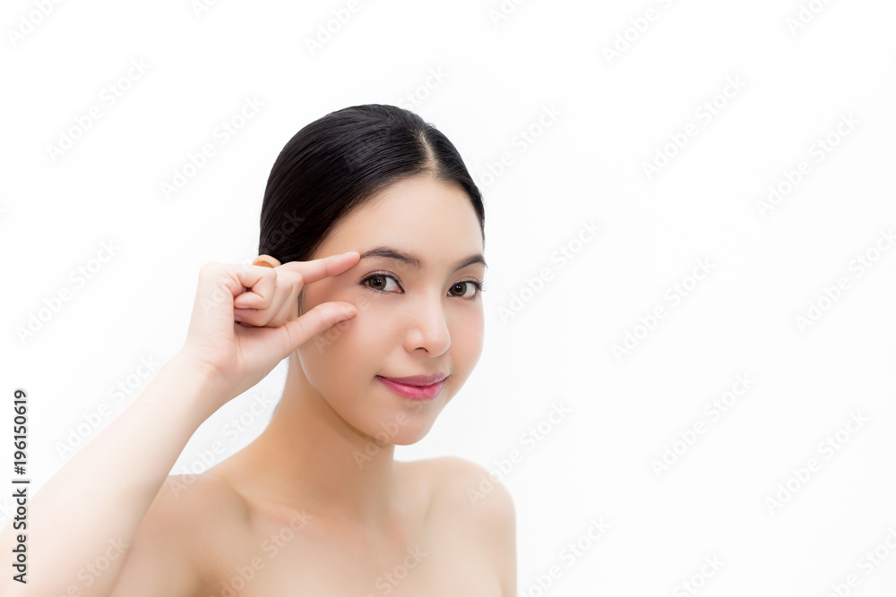 Young attractive woman in natural beauty condition gently touching eyes to focus on eyecare health isolated over white background. Young attractive woman in natural beauty condition gently touching eyes to focus on eyecare health isolated over white background.