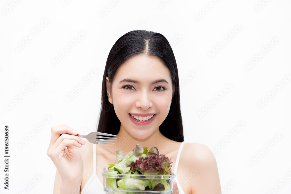 Young Asian beautiful smiling slim woman eating vegetable salad - healthy and diet eating lifestyle concept. Young Asian beautiful smiling slim woman eating vegetable salad - healthy and diet eating lifestyle concept.