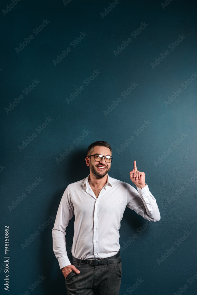 Cheerful man wearing glasses have an idea.