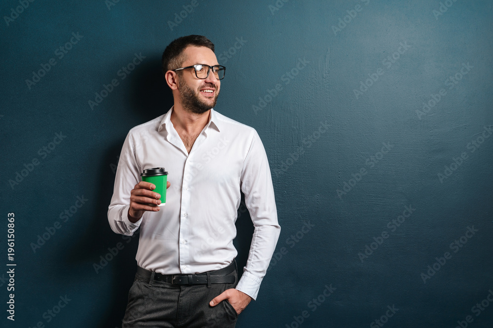 Happy man standing over dark blue background