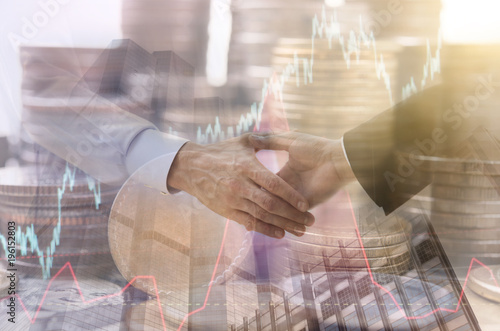 Double exposure handshake with stock graph and coin money. concept business achievement economy finance.