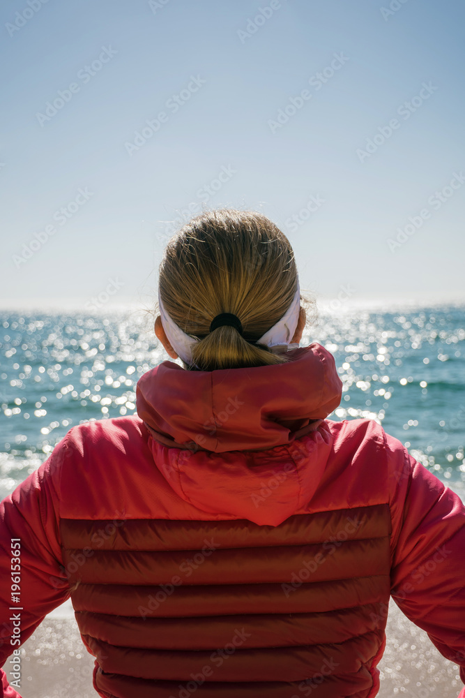 Mature woman playing sport on a secluded beach. Mature woman playing sport on a secluded beach.