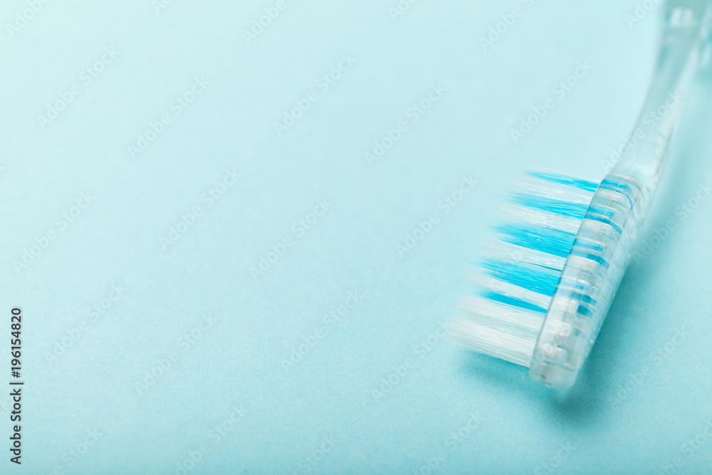 Close up, toothbrushes on empty blue background. Copy space for text. Close up, toothbrushes on empty blue background. Copy space for text.