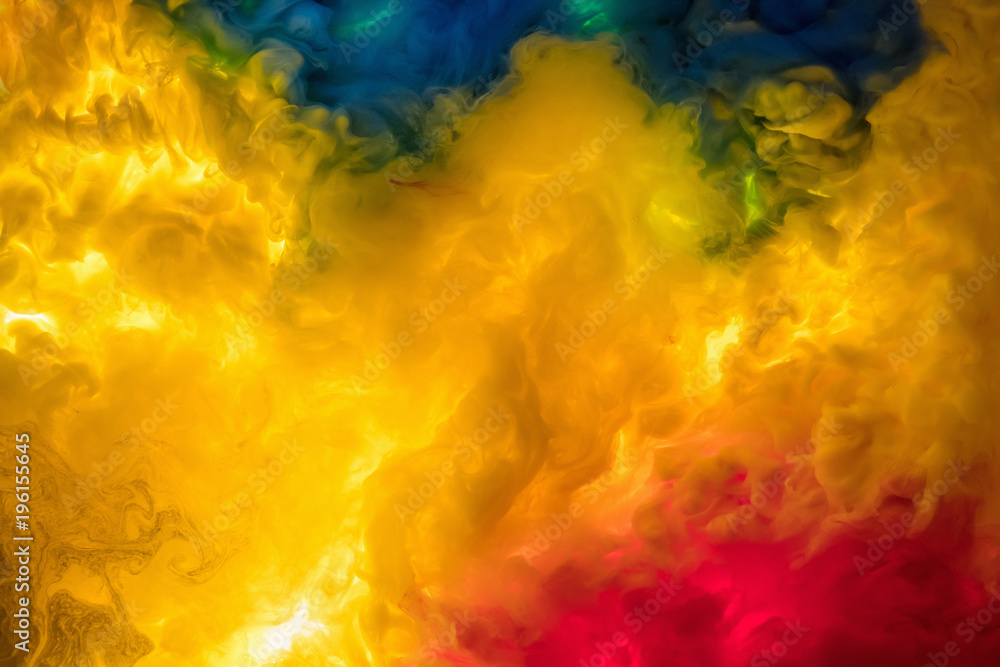 ink in the water. A splash of red, blue, yellow and green paint. Abstract  background Stock Photo | Adobe Stock