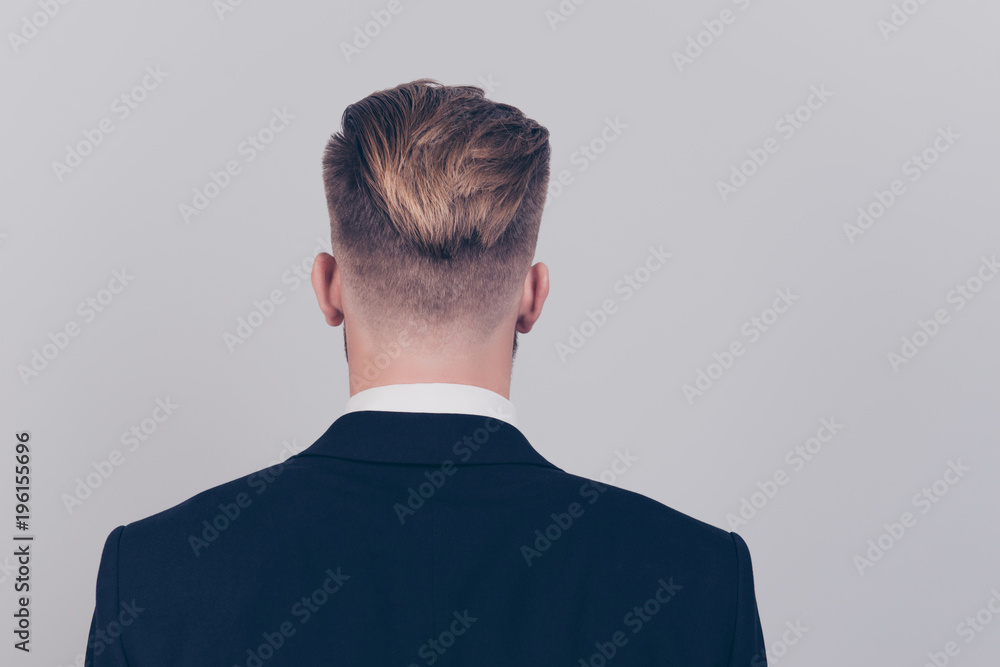 Behind rear back view photo of handsome attractive serious agent marketer staying straight wearing black dark blazer white collar isolated on gray background copy-space Behind rear back view photo of handsome attractive serious agent marketer staying straight wearing black dark blazer white collar isolated on gray background copy-space