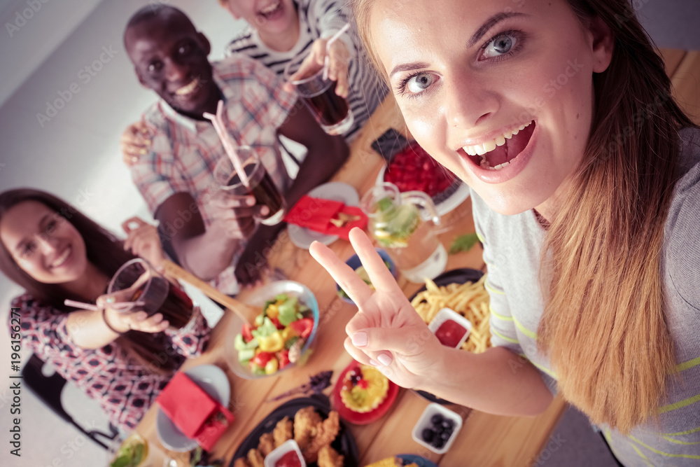 Group of people doing selfie during lunch. Self. Friends. Friends are photographed for eating Group of people doing selfie during lunch. Self. Friends. Friends are photographed for eating