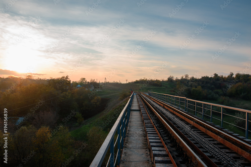 Fototapeta premium Landscape of sunset and railroad in village. Moldova 2017.