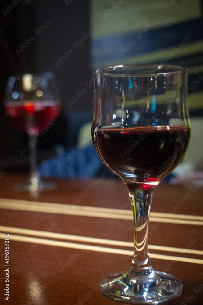 Pouring red wine into the glass Pouring red wine into the glass
