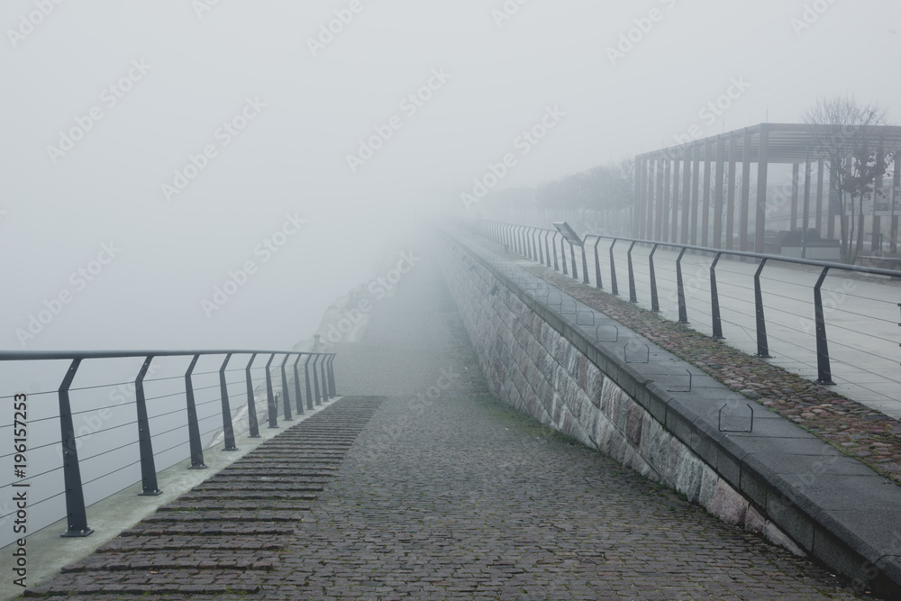 Fototapeta premium Boulevard on the Vistula river at foggy morning in Warsaw, Poland