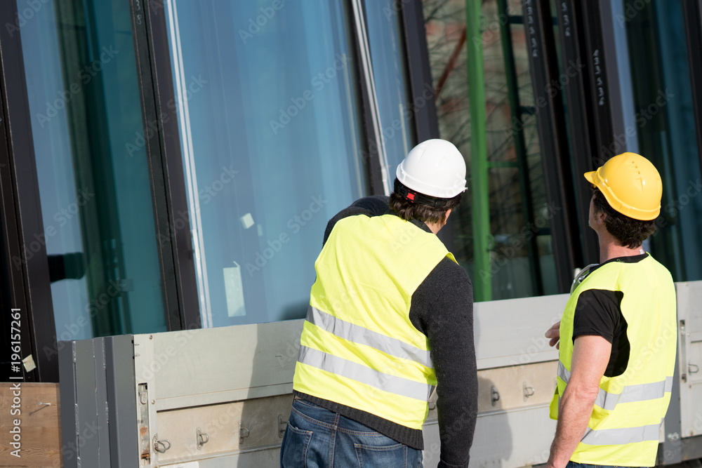 © cineberg - Construction workers at work on construction site