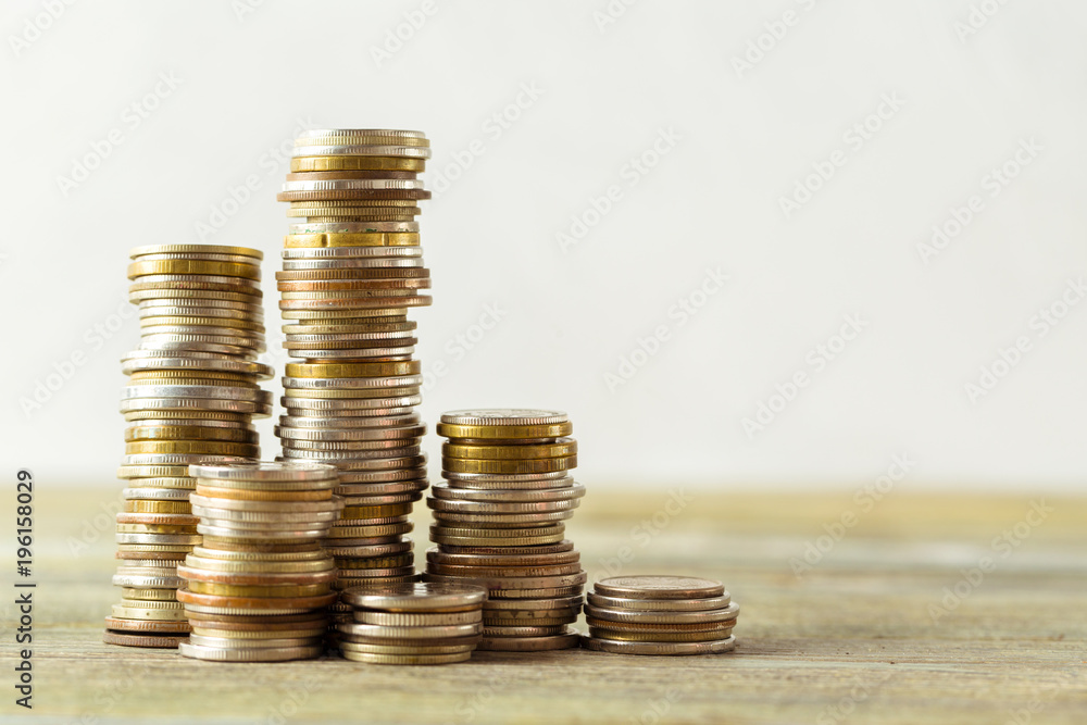 coins stack on wooden table coins stack on wooden table