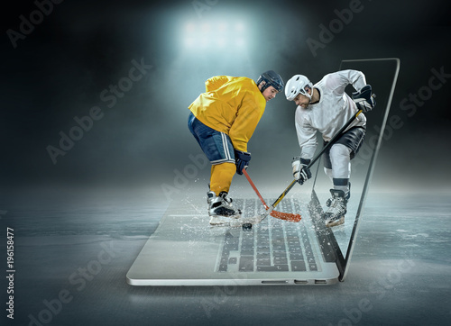 Canvas Print Caucassian ice hockey Players in dynamic action in a professiona
