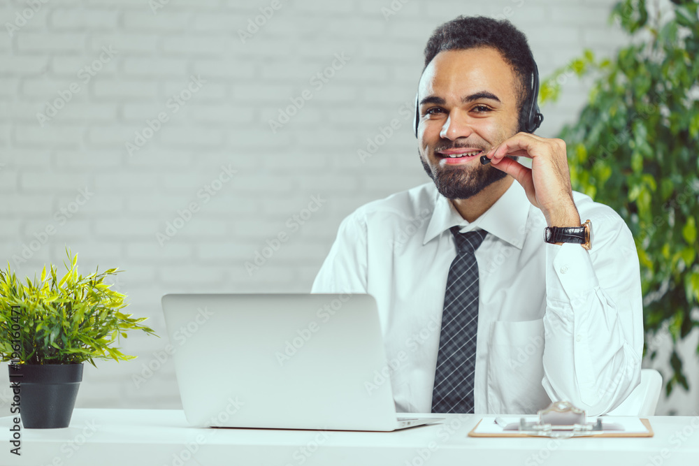 Man with headphones. Call center operator speaking with client Man with headphones. Call center operator speaking with client