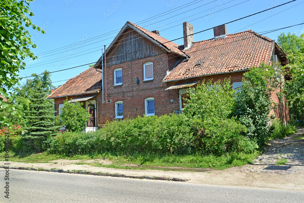 Red brick house of pre-war construction. Settlement Amber, Kaliningrad region
