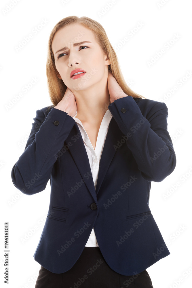 Beautiful caucasian business woman touching her neck. Beautiful caucasian business woman touching her neck.