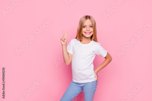 Fun joy enjoy people person funtime concept. Portrait of cute lovely carefree confident sweet adorable beautiful girl in casual modern outfit demonstrating v-sign isolated on pink background