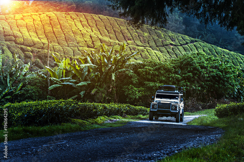 Tableau sur toile Traveling in the green mountains with off road vehicle