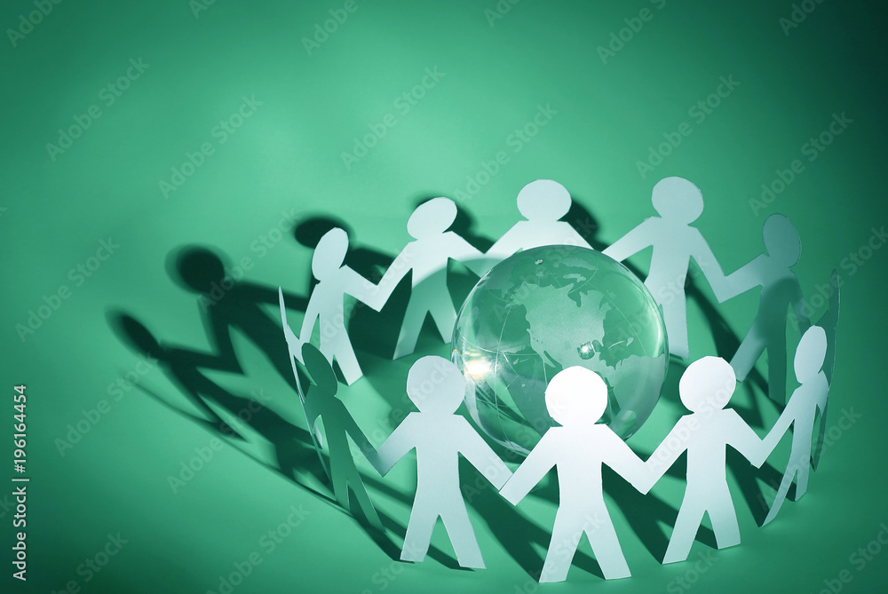 group of paper men standing around the glass globe group of paper men standing around the glass globe
