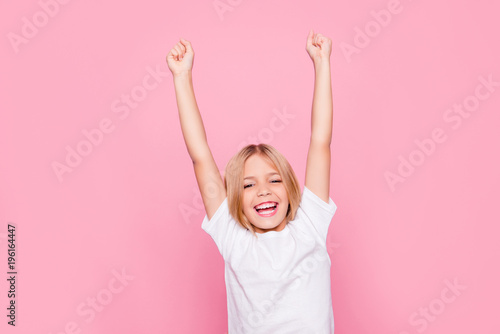 Holiday weekend event fortune luck delight rejoice people lifestyle leisure concept. Portrait of charming cheerful emotional excited joyful girl raising hands up isolated on gray background