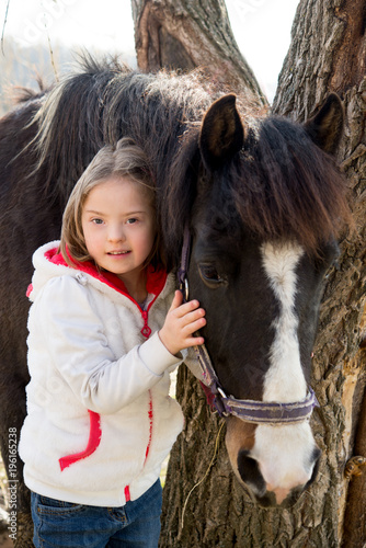 Down syndrome girl enjoying horse riding © mooseshop
