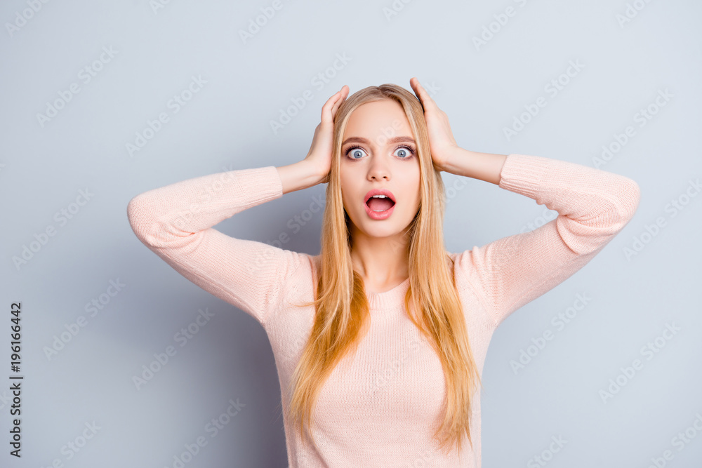 It's black friday! Unexpected incredible grimace people concept. Close up portrait of cute beautiful pretty lovely with big blue eyes businesswoman holding head with hands isolated on gray background It's black friday! Unexpected incredible grimace people concept. Close up portrait of cute beautiful pretty lovely with big blue eyes businesswoman holding head with hands isolated on gray background