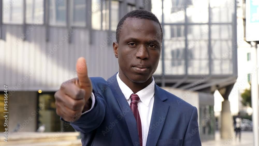 Confident succesful black businee man making thumbs up- outdoor Confident succesful black businee man making thumbs up- outdoor