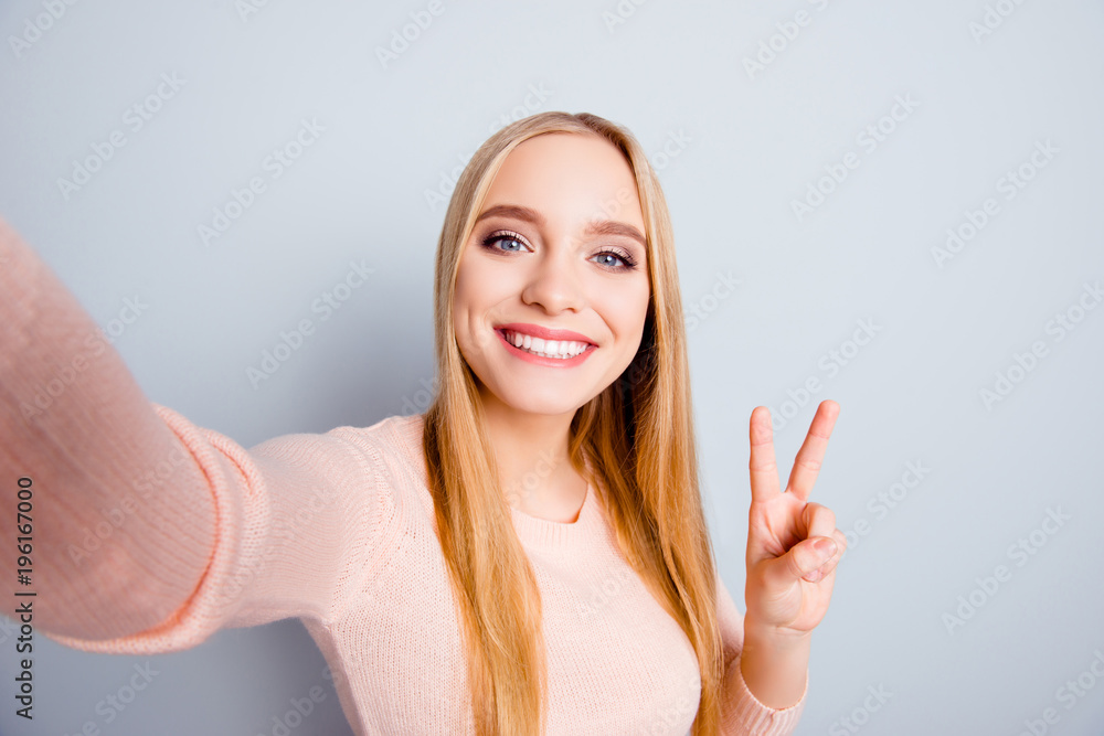 Connection casual roaming glamour style toothy people funtime person concept. Close up portrait of cute cheerful excited sweet lovely joyful girl taking selfie with v-sign isolated on gray background Connection casual roaming glamour style toothy people funtime person concept. Close up portrait of cute cheerful excited sweet lovely joyful girl taking selfie with v-sign isolated on gray background