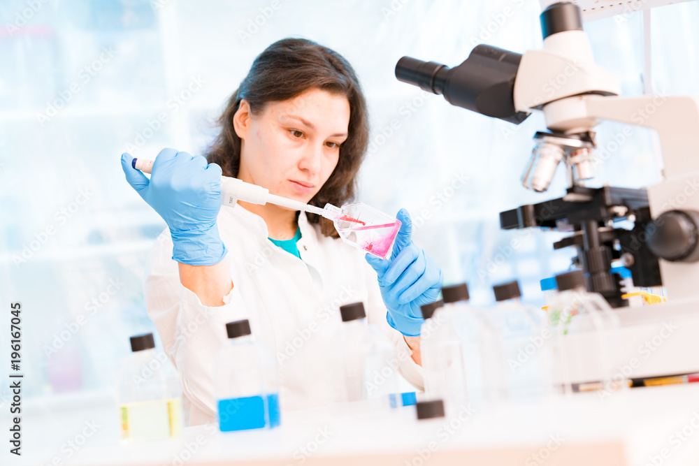 Fototapeta premium Young female technician in the laboratory of food quality control