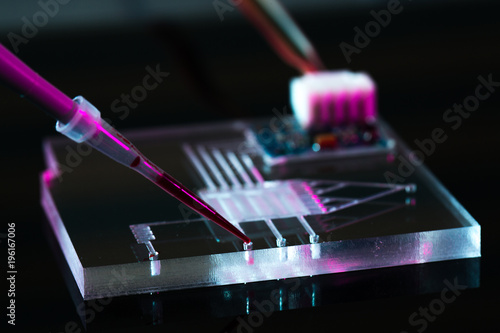 A lab-on-a-chip (LOC) is integration device with several laboratory functions photo