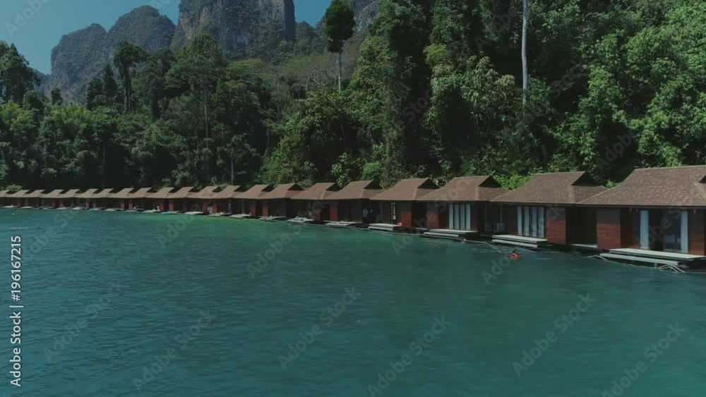 Tropical Thai jungle lake Cheo lan drone flight, wild mountains nature national park ship yacht, fishing boats Tropical Thai jungle lake Cheo lan drone flight, wild mountains nature national park ship yacht, fishing boats