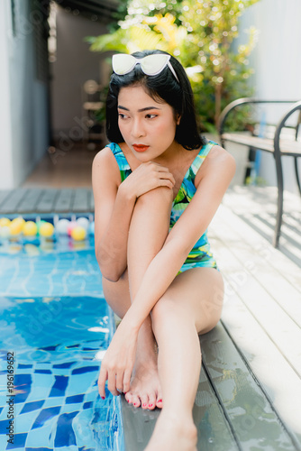 girl wear bikini in swimming pool