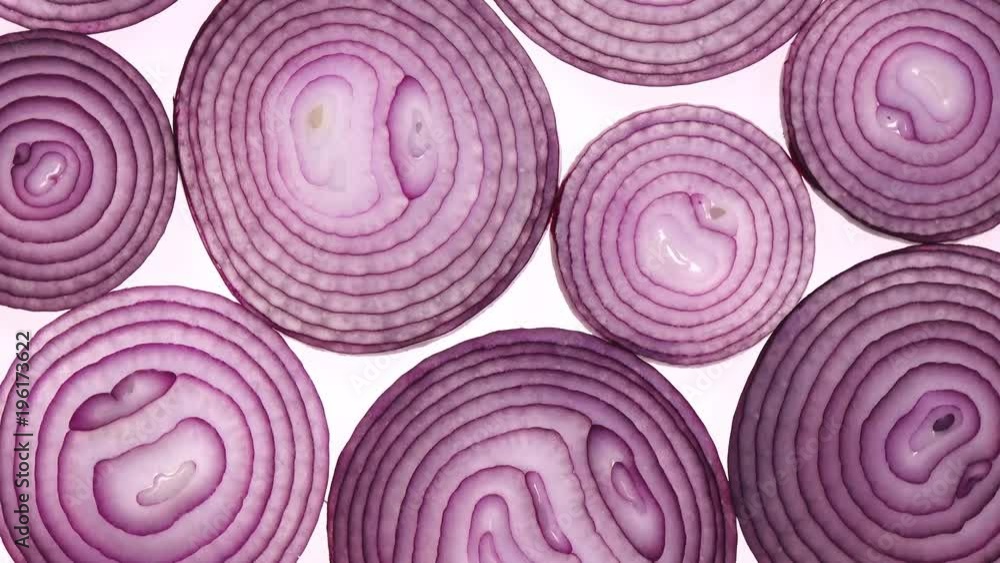 Sliced red onion rings rotating on white in 4K. Closeup top view of healthy food background with vegetable of rich vitamin.
Sliced red onion rings rotating on white in 4K. Closeup top view of healthy food background with vegetable of rich vitamin.