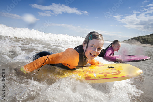 Girls Bodyboarding in the Sea